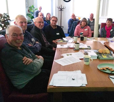 At least a dozen volunteers and trustees at a meeting in Taylor House