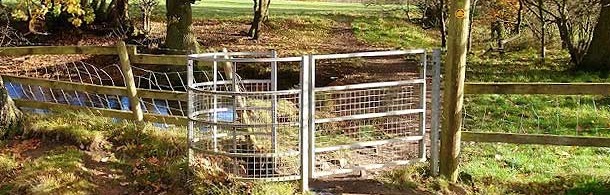 One of our signs near Jacob's Ladder with hills beyond